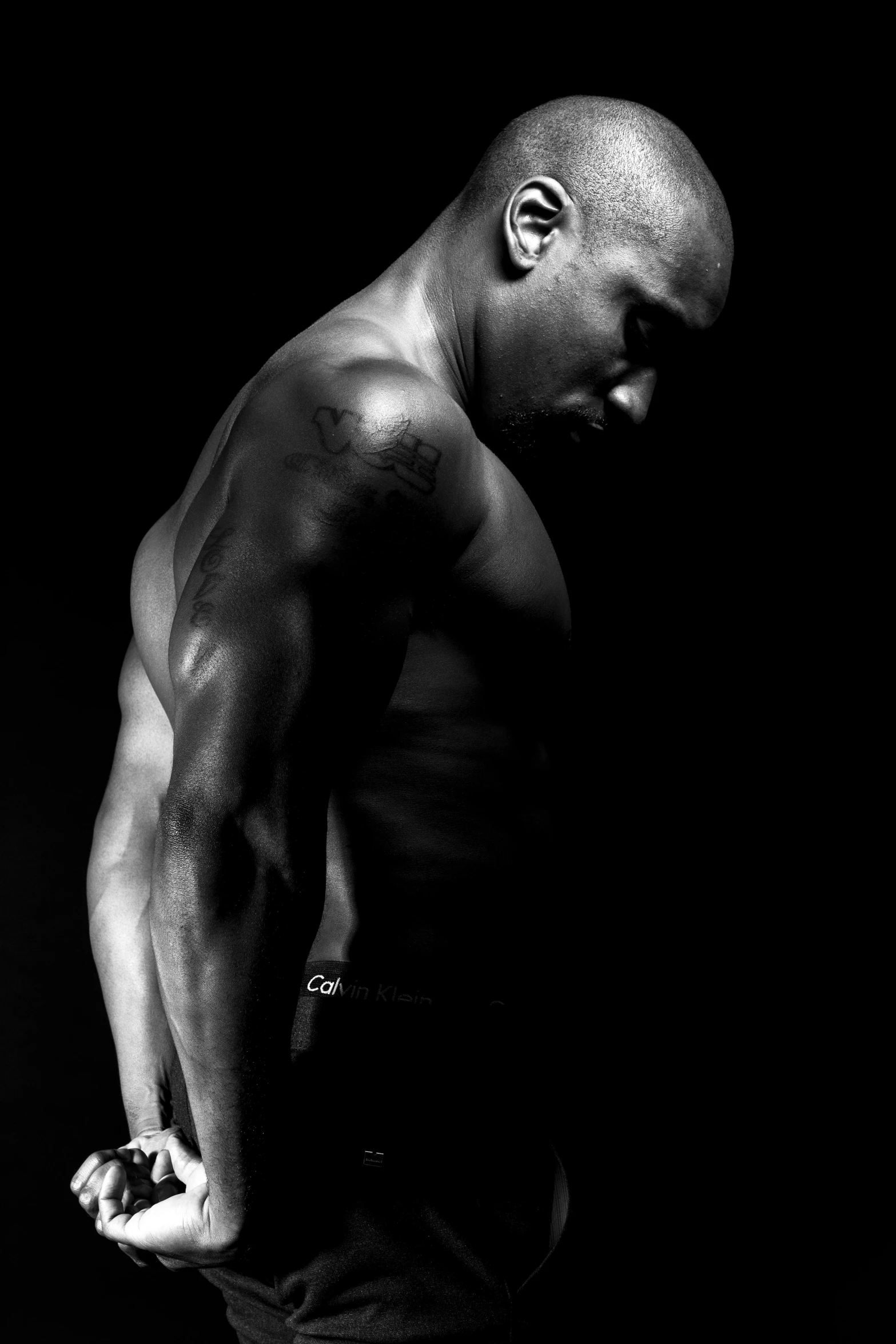 a black and white photo of a muscular man, inspired by Terrell James, deep!!!!!, nas, body format, profile photo