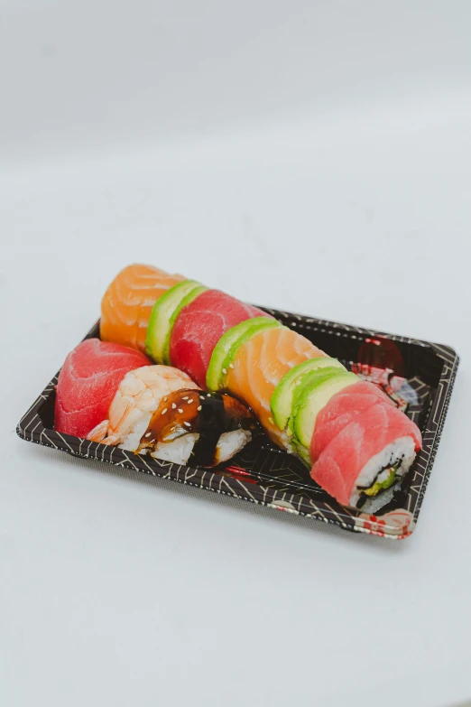 a close up of a plate of sushi, product image, angle view, marbled swirls, 6 pack