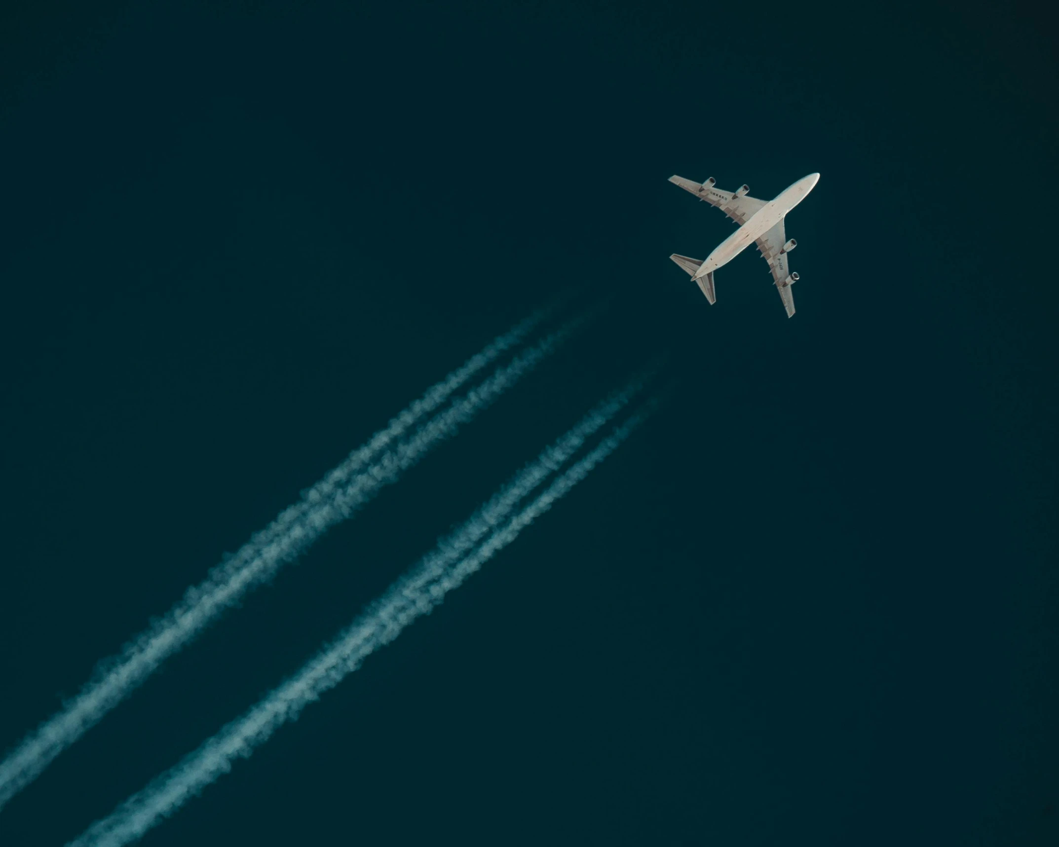 a large jetliner flying through a blue sky, pexels contest winner, minimalism, on black background, spores floating in the air, a high angle shot, thumbnail