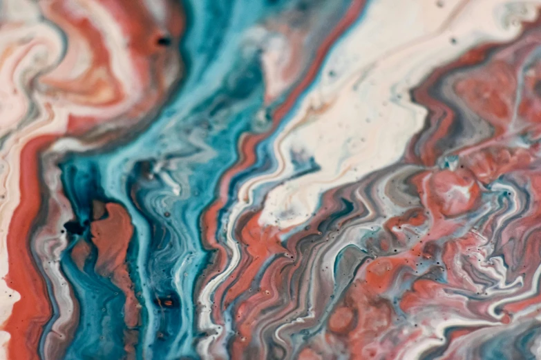 a close up of a marbled surface with red, white, and blue colors, trending on unsplash, abstract art, teal silver red, earth colors, pouring techniques, bismuth art