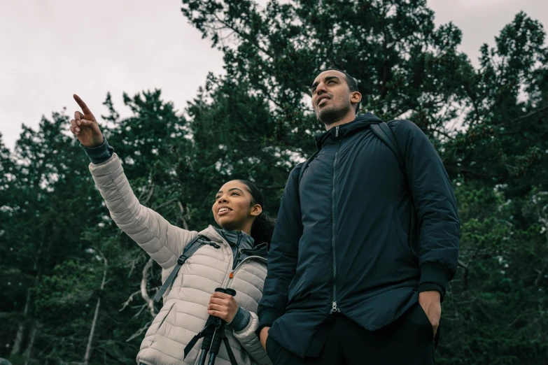 a man and a woman standing next to each other, pexels contest winner, sydney park, looking upward, hiking clothes, avatar image