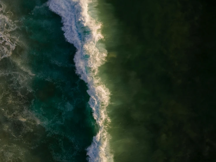 a person riding a surfboard on top of a wave, pexels contest winner, renaissance, color aerial photo drone, dark green water, abstract nature, sea foam