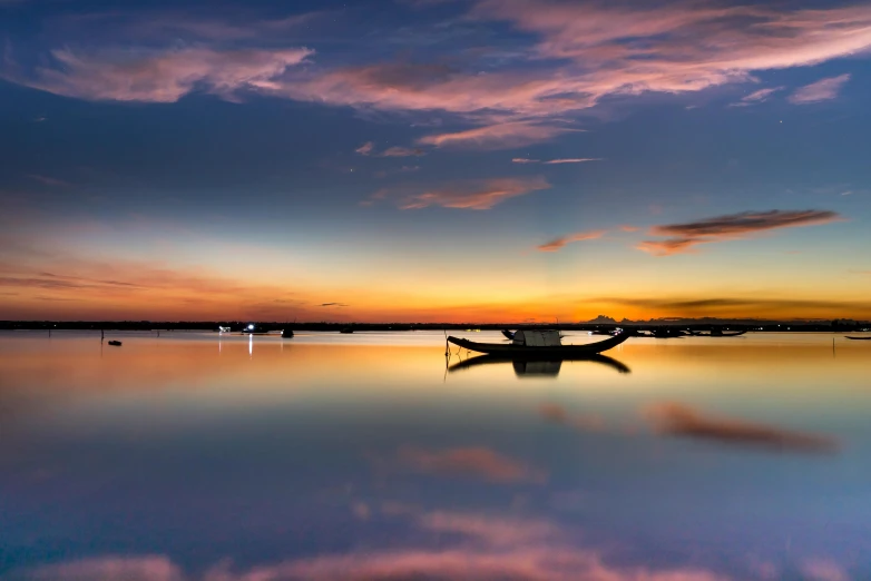 a group of boats floating on top of a body of water, by Eglon van der Neer, pexels contest winner, sunset panorama, vietnam, fine art print, iridescent reflections