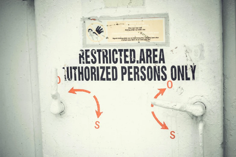 a sign that says restricted area authorized persons only, by Julia Pishtar, unsplash, graffiti, vintage photo, hands, enhanced photo, scp-049