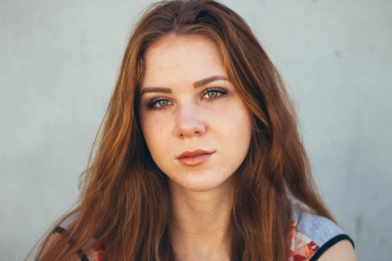 a close up of a woman with long red hair, unsplash, photorealism, sydney sweeney, looking to camera, portrait image