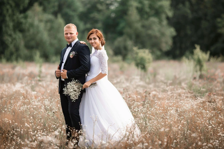 a bride and groom standing in a field of tall grass, a picture, krzysztof porchowski jr, portrait image, high quality upload, rectangle