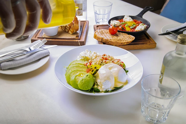 a close up of a plate of food on a table, avacado chairs, breakfast, profile image, daily specials