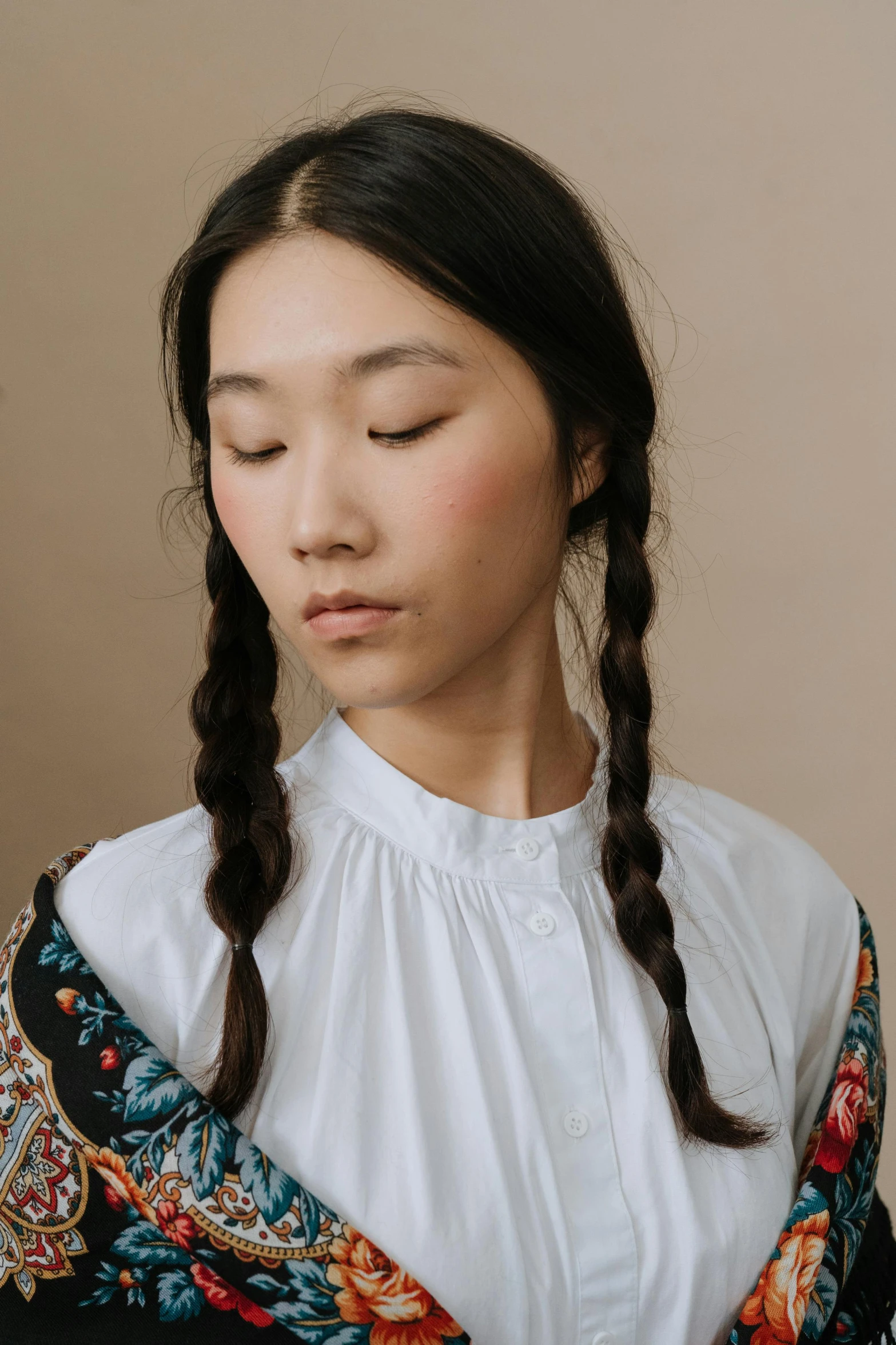 a woman with her eyes closed wearing a scarf, inspired by Kim Tschang Yeul, aestheticism, two braids, wearing a white button up shirt, ethnicity : japanese, louise zhang