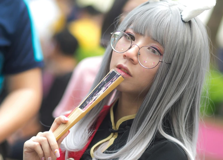 a woman with a tooth brush in her mouth, an album cover, inspired by Rumiko Takahashi, pexels contest winner, concept art of comiket cosplay, long grey beard, yanjun chengt, she wears harry potter glasses