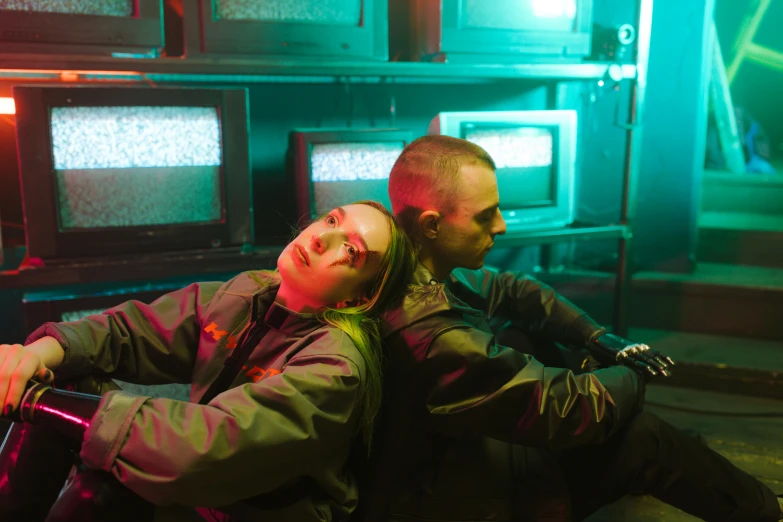 a man and a woman sitting next to each other, inspired by Elsa Bleda, pexels contest winner, bauhaus, wearing cyberpunk 2 0 7 7 jacket, alien room, performing a music video, vhs colour photography