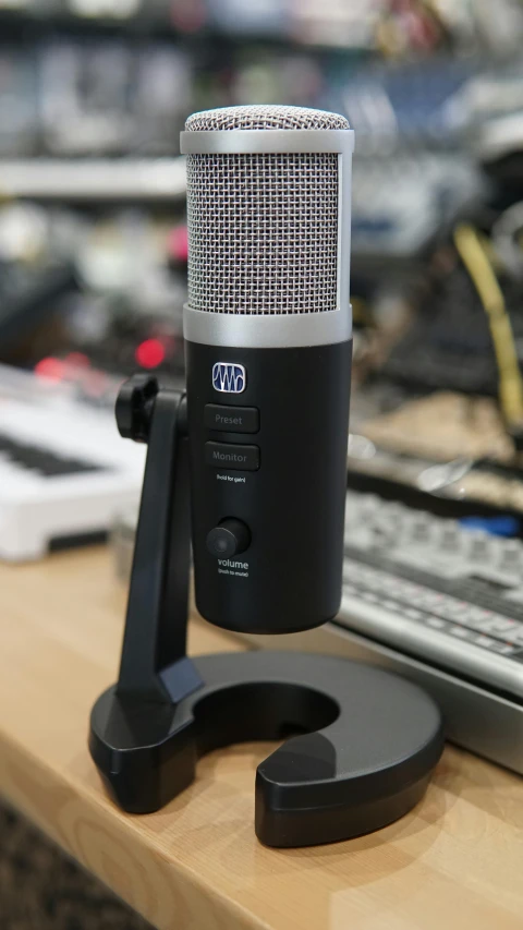 a microphone sitting on top of a desk next to a keyboard, portrait of gigachad, thumbnail, shogun audio, adafruit