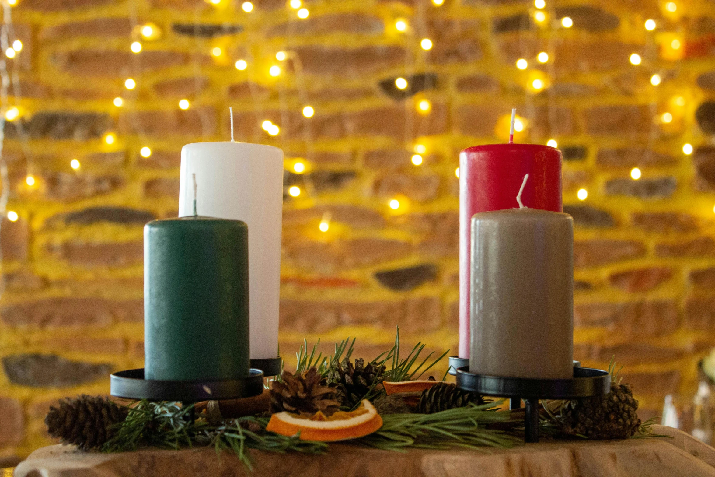 a couple of candles sitting on top of a table, inspired by Ernest William Christmas, renaissance, various colors, rustic, festive, item