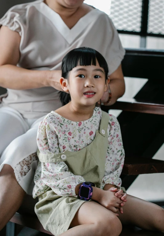 a woman combing a little girl's hair, by Yosa Buson, pexels contest winner, sitting on a chair, young cute wan asian face, twintails hairstyle, ( ( theatrical ) )