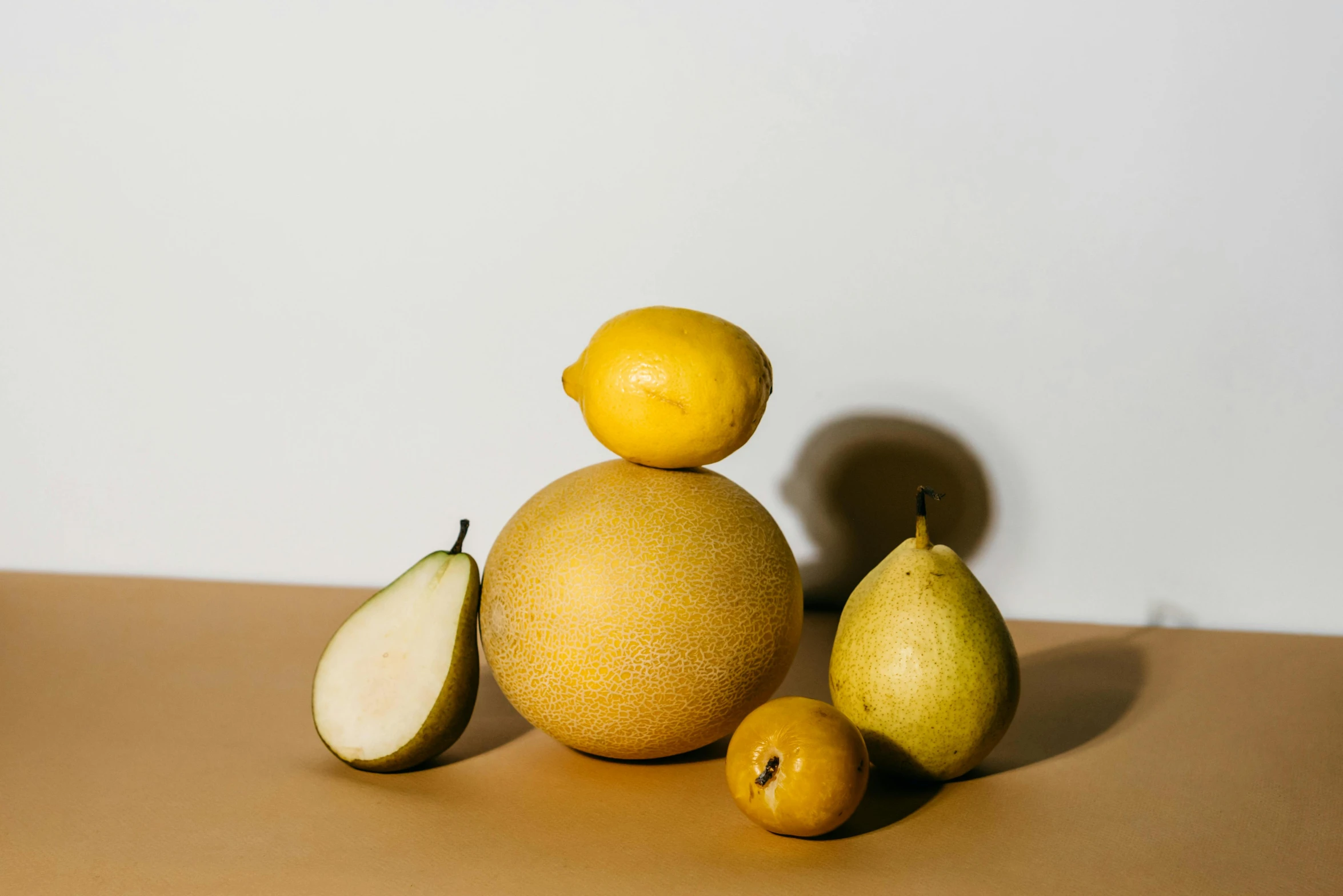 a pile of fruit sitting on top of a table, light yellow, product image, pear, full-figure