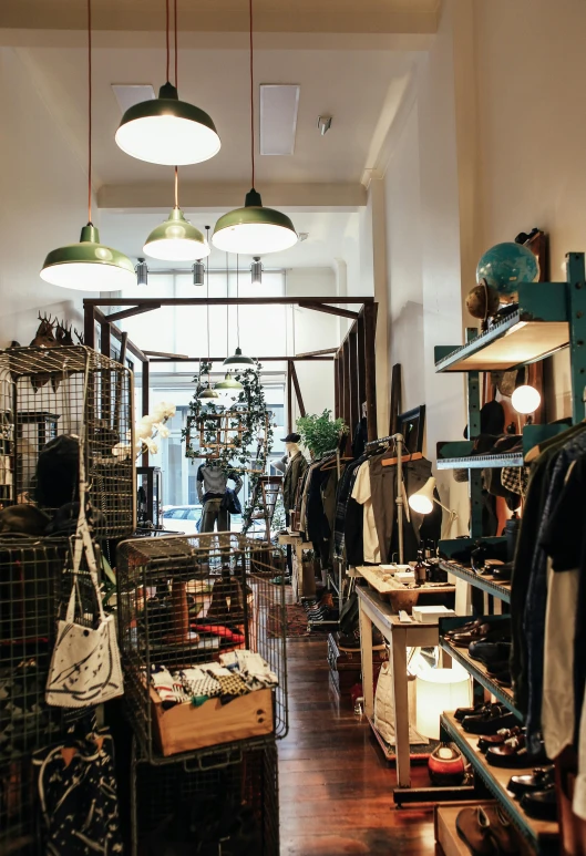 a room filled with lots of clothes and hanging lights, arte povera, fantastic vendor interior, thumbnail, melbourne, profile pic