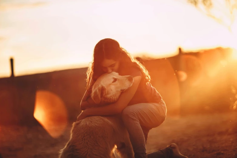 a woman sitting on the ground with a dog, pexels contest winner, romanticism, soft golden light, hugging each other, aussie, profile image