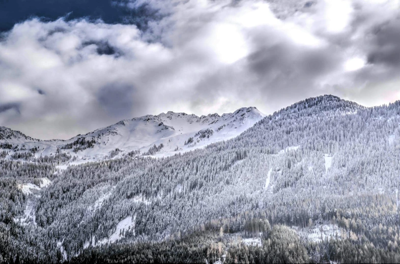 a group of people riding skis down a snow covered slope, by Peter Churcher, pexels contest winner, romanticism, ominous! landscape of north bend, panorama view, hdr detail, grey