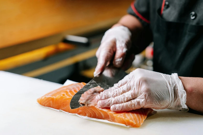 a person cutting up a piece of fish on a cutting board, thumbnail, ukiyo, premium quality, te pae