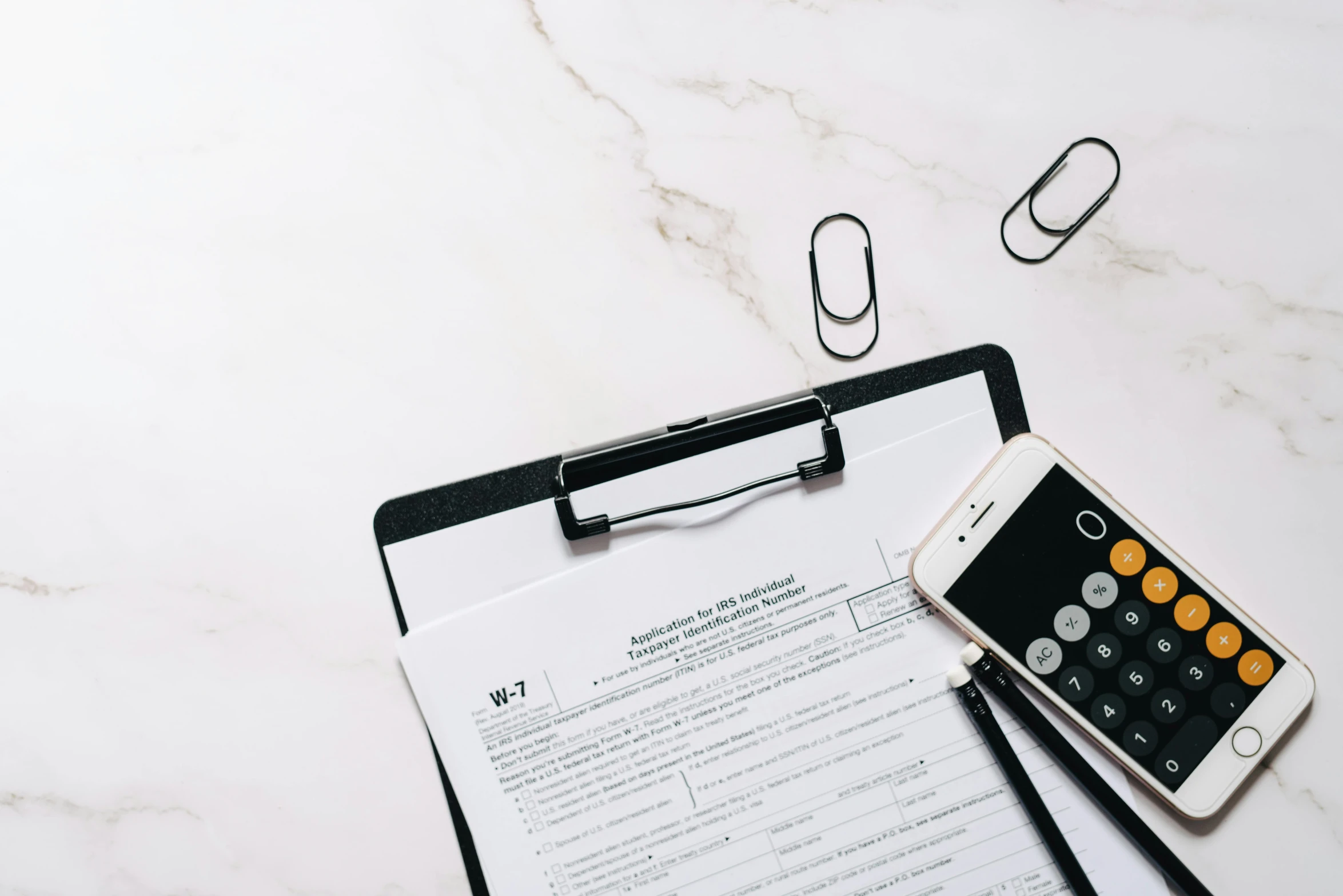 a cell phone sitting on top of a clipboard next to a calculator, trending on pexels, instagram post, no - text no - logo, forms, white and black color palette