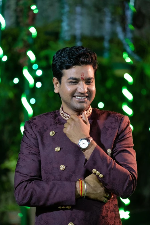a man standing in front of a christmas tree, samikshavad, garbed in a purple gown, smiling male, profile image, wedding
