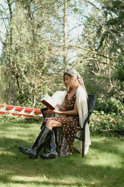 a woman sitting on a bench reading a book, wearing a camisole and boots, cottagecore hippie, profile image