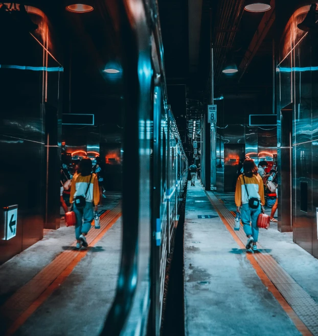 a group of people walking through a train station, by Beeple, pexels contest winner, focus on two androids, mirror reflection, orange and teal color, inside of a tokyo garage