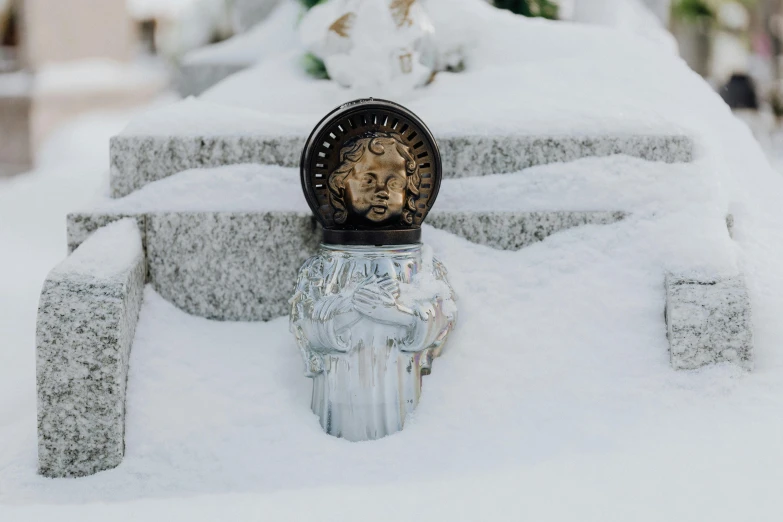 a close up of a fire hydrant covered in snow, a statue, by Emma Andijewska, unsplash, wearing angel halo covered face, in style of chrome hearts, detailed product photo, metal lid