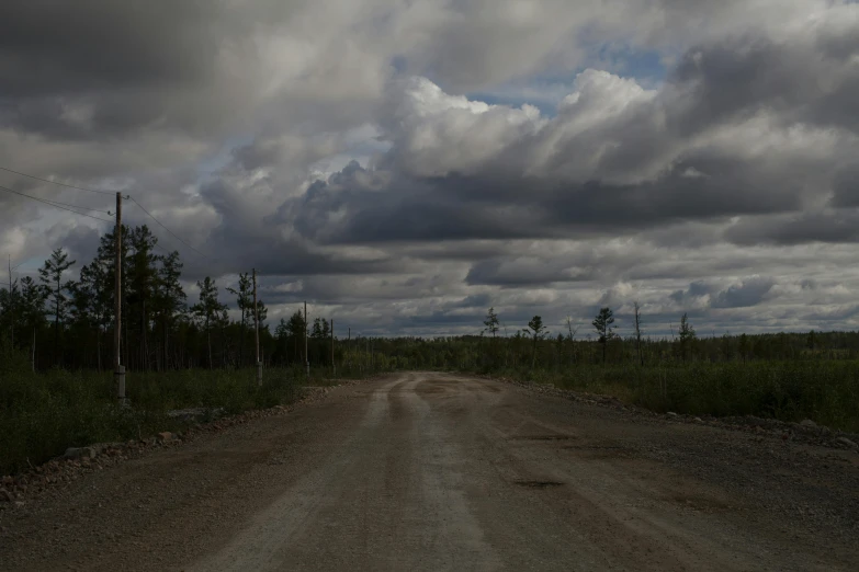 a dirt road with a cloudy sky in the background, by Jaakko Mattila, hurufiyya, boundary of two lands, modeled, grey, paul barson