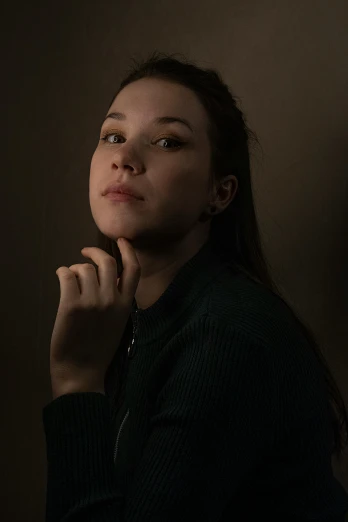 a woman standing in a dark room with her hand on her chin, a character portrait, unsplash, hyperrealism, hailee steinfeld, taken in the late 2010s, ((portrait)), portrait. 8 k high definition