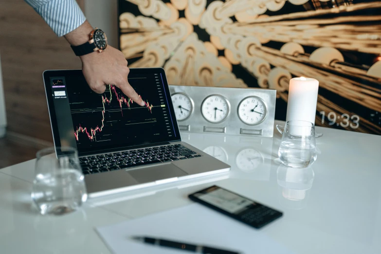 a laptop computer sitting on top of a white table, trending on pexels, analytical art, currency symbols printed, night time, traders, ( 3 1