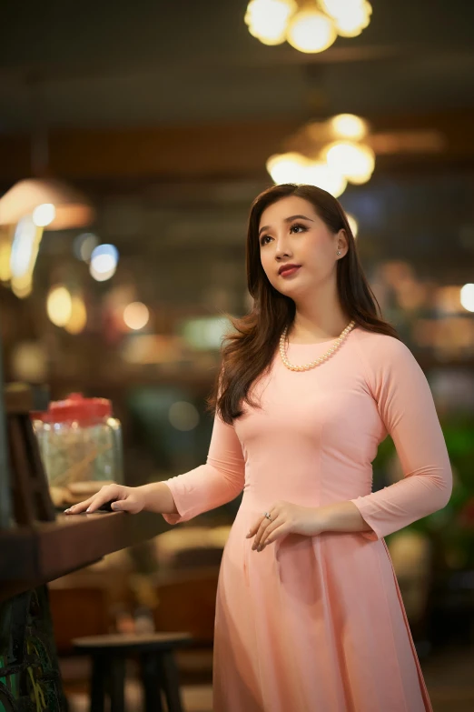 a woman in a pink dress standing next to a piano, inspired by Ni Yuanlu, pexels contest winner, ( waitress ) girl, mai anh tran, square, evening lighting