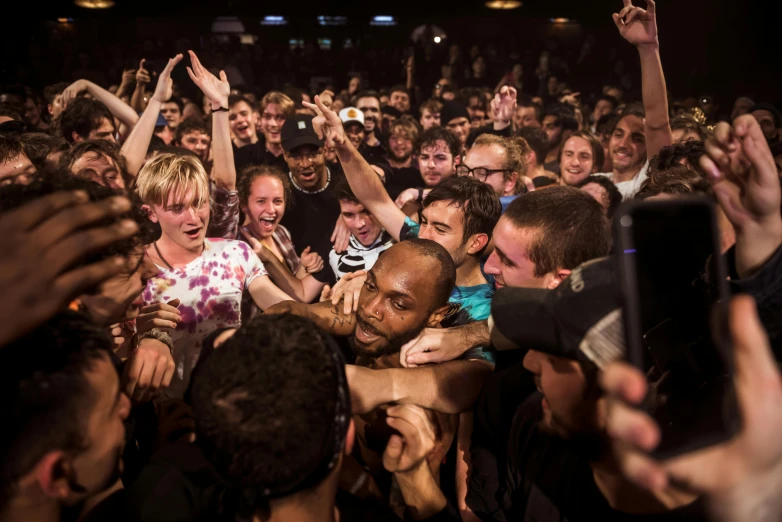 a crowd of people with their hands in the air, an album cover, by Niko Henrichon, pexels contest winner, happening, dave chappelle, extreme fisheye, bo burnham, holding an epée