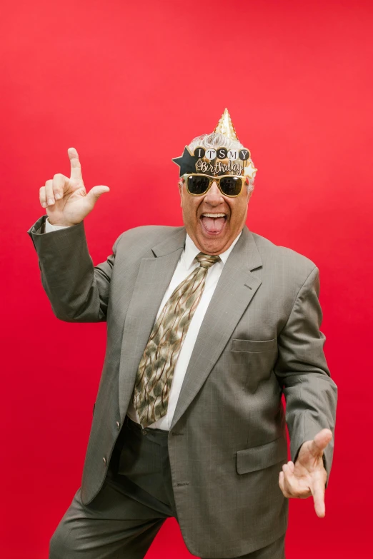 a man wearing a party hat and sunglasses, an album cover, inspired by John Maxwell, stuckism, gene espy, wearing golden crown, giving a thumbs up, super high resolution