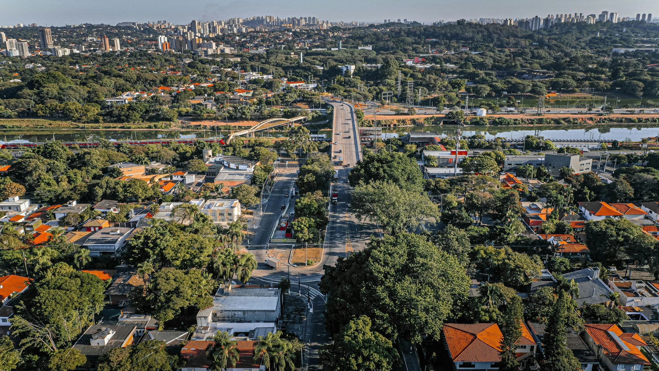 an aerial view of a city with lots of trees, by Ceferí Olivé, orange line, fan favorite, maxwell boas, long view