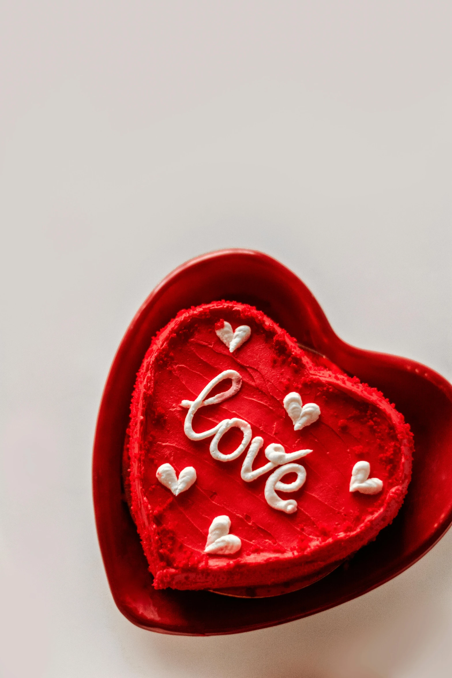 a red heart shaped box sitting on top of a table, a picture, pexels, love theme, kek, made of glazed, medium