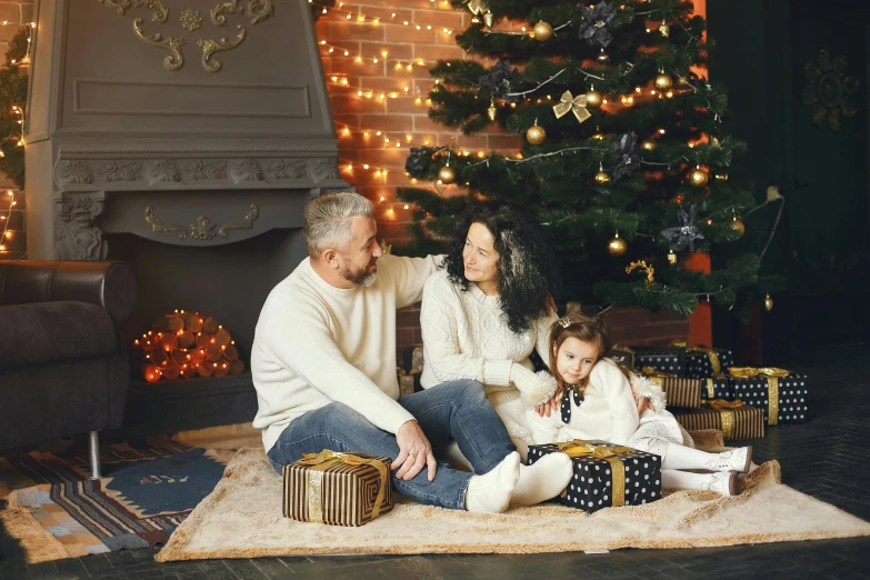 a family sitting on the floor in front of a christmas tree, a portrait, pexels, incoherents, portrait image, good lighted photo, profile pic, thumbnail