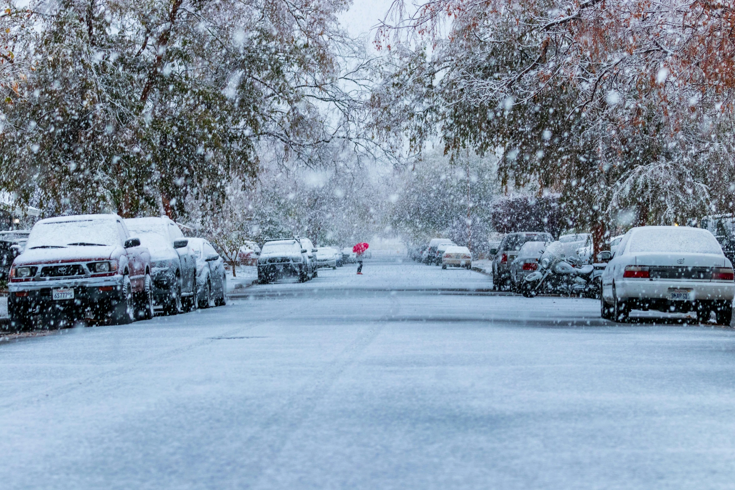 a street filled with lots of snow covered cars, by Winona Nelson, pexels contest winner, walking through a suburb, hailstorm, thumbnail, colour photo