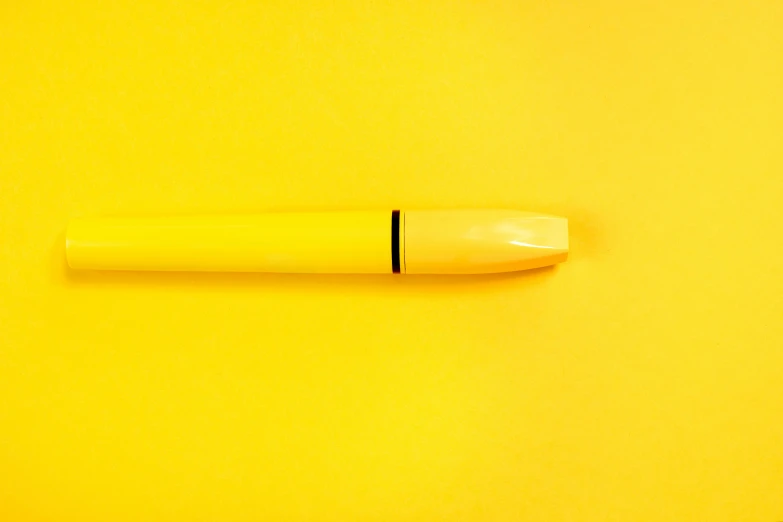 a yellow pen sitting on top of a yellow surface, by Doug Ohlson, unsplash, minimalism, hyperrealistic n- 4, manga pen, dezeen, high angle close up shot