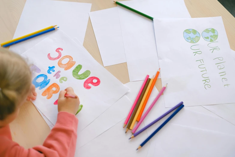 a little girl that is sitting at a table, a child's drawing, trending on pexels, letter s, 3 colour print, commercial banner, close-up shot from behind