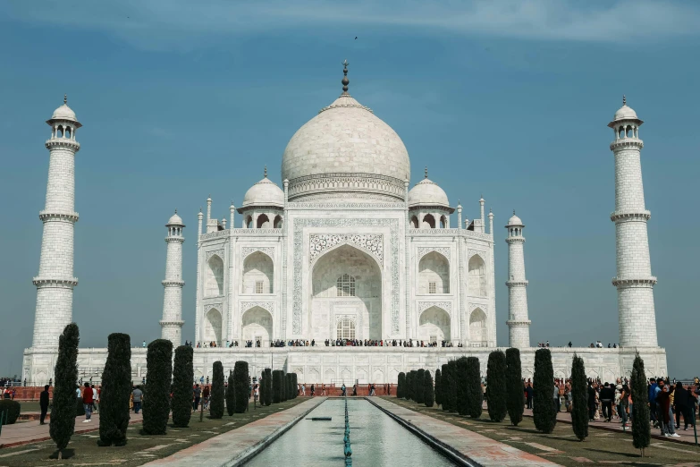 a group of people standing in front of a white building, a marble sculpture, inspired by Steve McCurry, pexels contest winner, renaissance, taj mahal made of cheese, indian patterns, dome, inside a grand