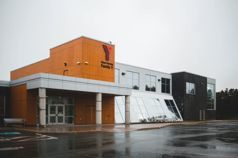 a building with a car parked in front of it, a digital rendering, unsplash, vancouver school, slight overcast, local gym, you, ye mighty