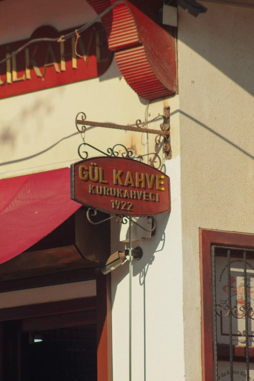 a sign that is on the side of a building, inspired by Juraj Julije Klović, art nouveau, gourmet and crafts, turkey, bay area, slightly tanned