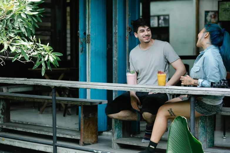 a man and a woman sitting at a table, pexels contest winner, aussie baristas, lush surroundings, avatar image, background image