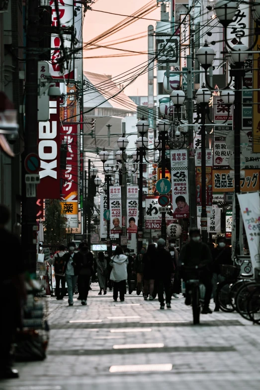 a group of people walking down a street next to tall buildings, a photo, pexels contest winner, ukiyo-e, lots of signs and shops, ethnicity : japanese, square, maze of streets