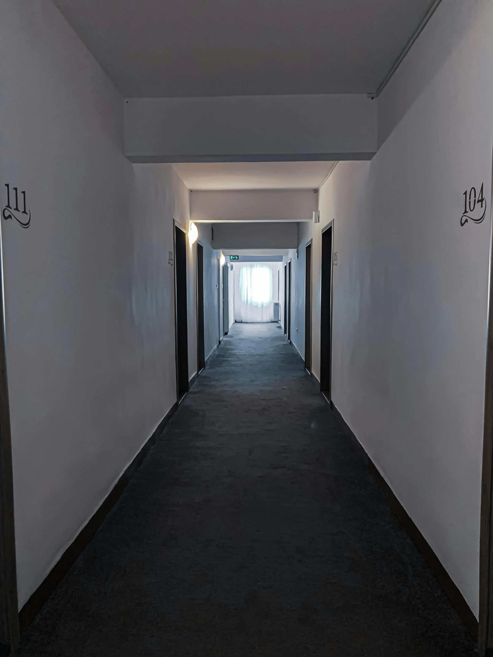 a long hallway with a light at the end of it, silent hill in real life, hotel room, studio 4°c, background image