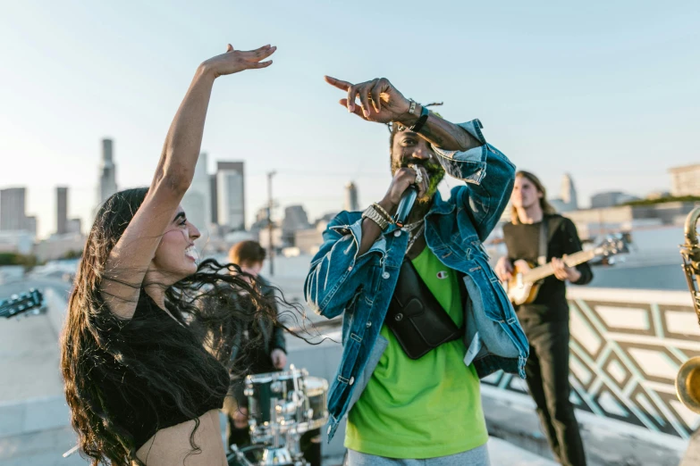 a group of people standing on top of a roof, an album cover, pexels contest winner, happening, performing a music video, mc ride, charli bowater and artgeem, shot on sony a 7