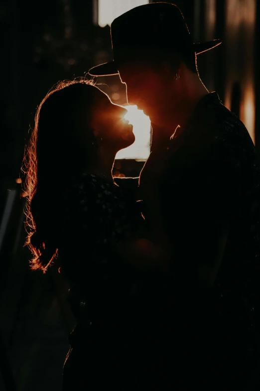 a man and woman kissing in the dark, a picture, pexels contest winner, holding a torch, sun lit, slightly pixelated, drinking