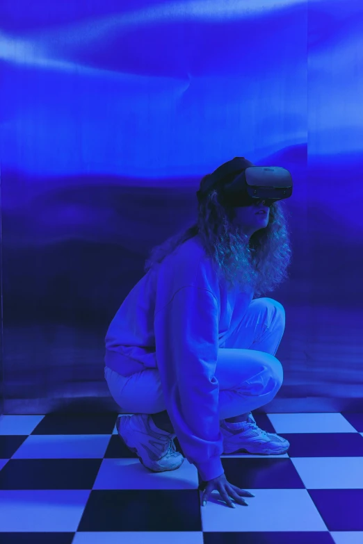 a man kneeling on a black and white checkered floor, inspired by David LaChapelle, trending on pexels, interactive art, sleek oled blue visor for eyes, lofi girl aesthetic, purple ambient light, wearing vr goggles