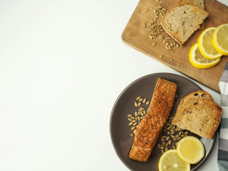 two slices of bread and two slices of lemon on a plate, trending on pexels, dau-al-set, salmon khoshroo, thumbnail, background image, panoramic shot