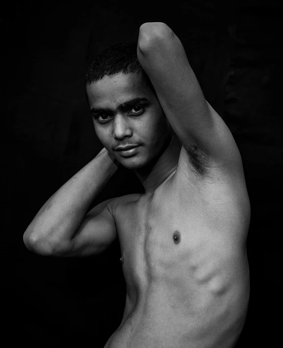 a black and white photo of a shirtless man, a black and white photo, by Cosmo Alexander, black teenage boy, saadane afif, posing for the camera, taken in the late 2010s